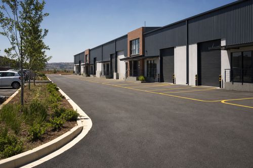 Fresh asphalt surfacing at a light industrial Gauteng yard